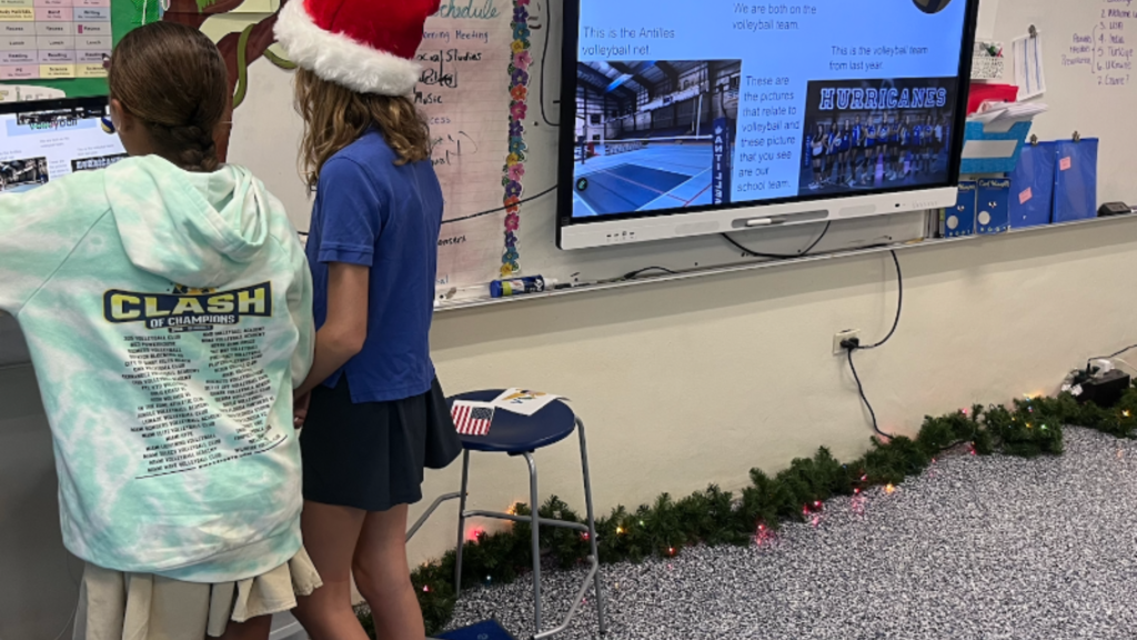 Two students presenting their volleyball hobby to a partner class in an international collaborative project on Class2Class